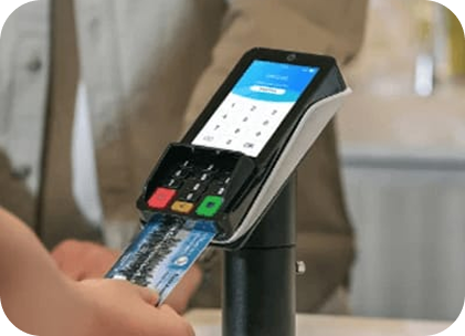 A person holding the compact PINPad