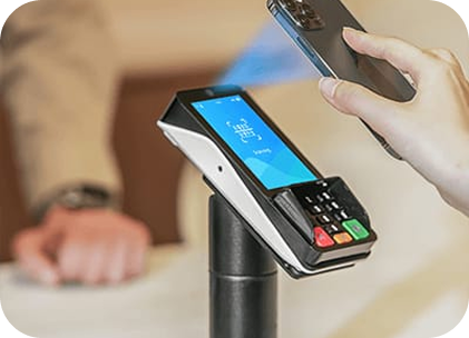 A person holding the compact PINPad