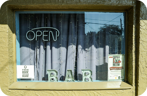 Open sign in a bar window